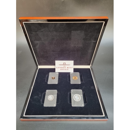 359 - Coins: a cased set of four Elizabeth II coins comprising: a 1963 brilliant uncirculated gold soverei... 