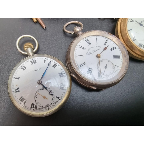 884 - A continental .935 key wind pocket watch, the dial signed H.E. Peck, London, 50mm; together with thr... 