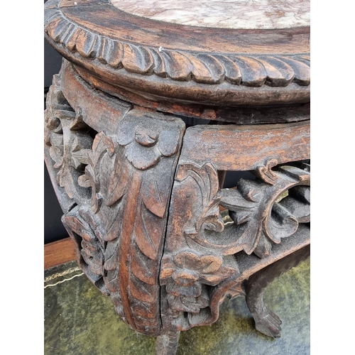 1041 - A Chinese carved hardwood and marble inset jardiniere stand, 61.5cm high.