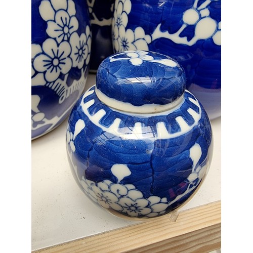 1129 - Fourteen Chinese blue and white ginger jars and eight covers, largest 14.5cm high.