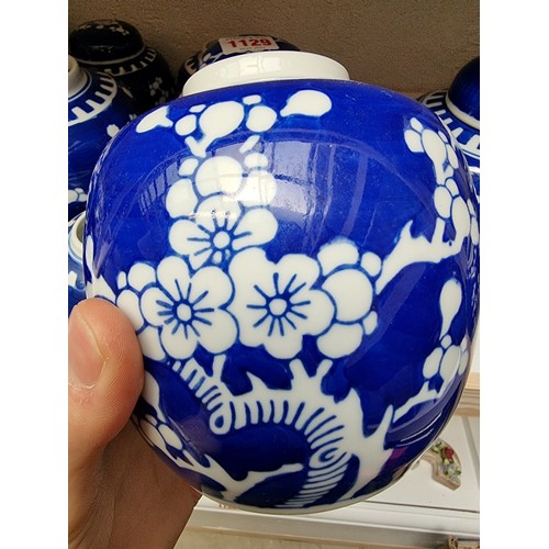 1129 - Fourteen Chinese blue and white ginger jars and eight covers, largest 14.5cm high.