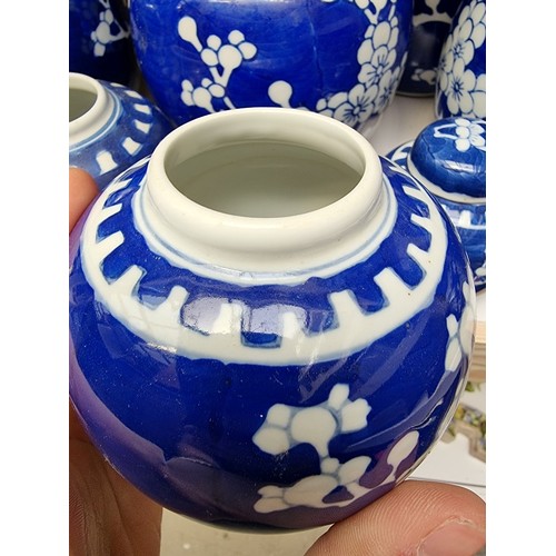 1129 - Fourteen Chinese blue and white ginger jars and eight covers, largest 14.5cm high.