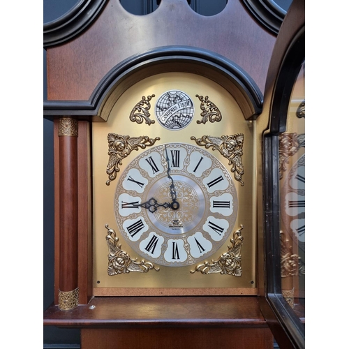 1005 - A reproduction mahogany longcase clock, by 'ECS, Germany' chiming on eight straight gongs, 213cm hig... 