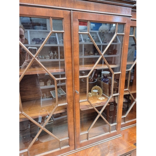 1007 - A reproduction mahogany and line inlaid breakfront display cabinet, 150.5cm wide.