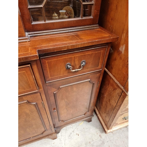1007 - A reproduction mahogany and line inlaid breakfront display cabinet, 150.5cm wide.