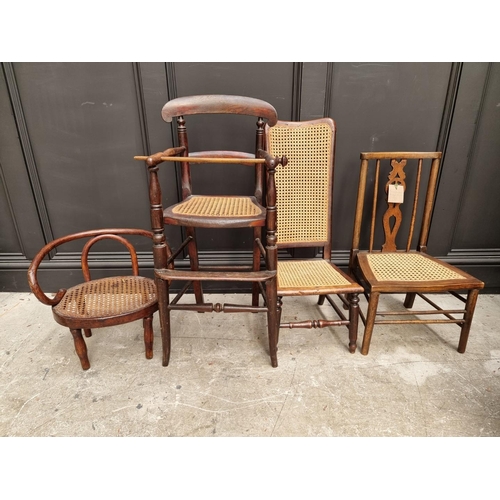 1009 - Four old cane seat childs' chairs, to include a bentwood example. (4)