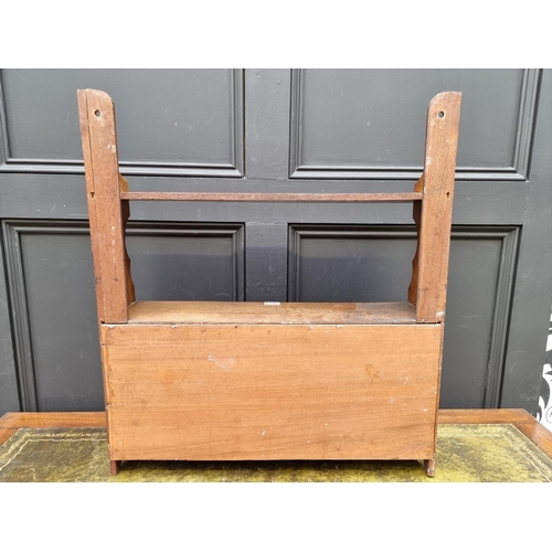 1014 - A small early 20th century oak hanging cabinet, 57cm wide.  