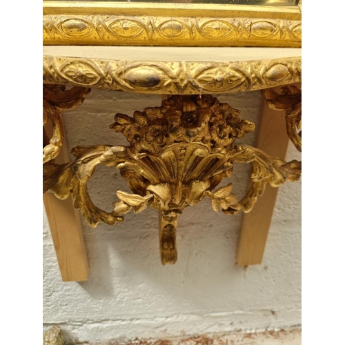 1022 - An unusual antique giltwood framed pier mirror, incorporating a shelf and pair of candle branches, 1... 