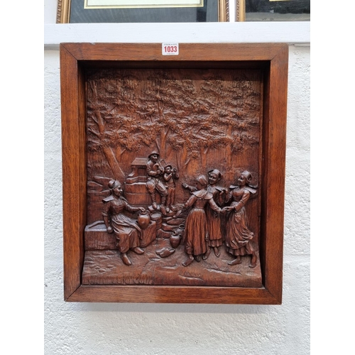 1033 - A Black Forest style carved oak relief panel of figures merrymaking, in oak frame, the whole 50.5 x ... 