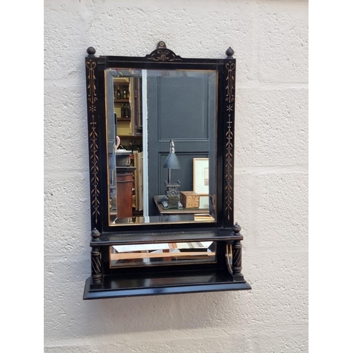 1034 - An Aesthetic ebonized mirrored wall shelf, 64cm high x 41.5cm wide.