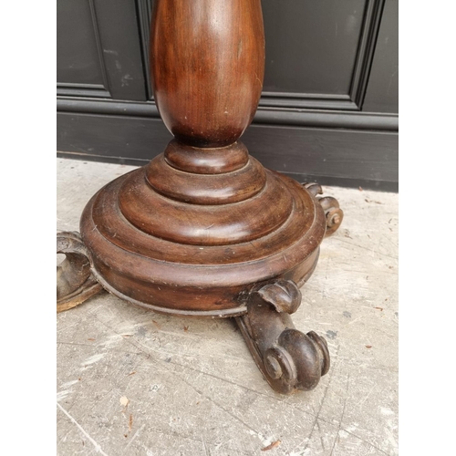 1036 - A 19th century mahogany and marble top circular pedestal occasional table, 53.5cm wide.... 