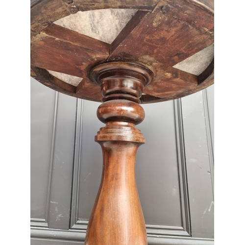 1036 - A 19th century mahogany and marble top circular pedestal occasional table, 53.5cm wide.... 