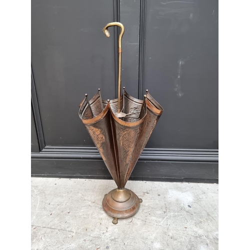 1038 - A novelty brass and copper umbrella stick stand, 81.5cm high. 
