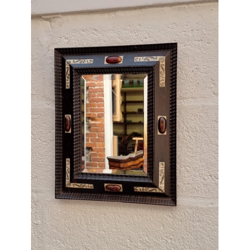 1039 - An unusual 17th century style ebonized frame wall mirror, with bone and cabochon decoration, 37 x 29... 