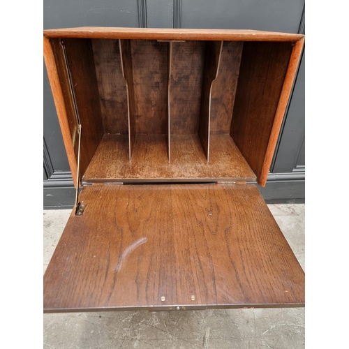 1050 - A mid-century oak record cabinet, 51cm wide