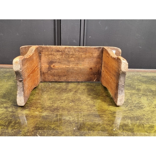 1051 - An antique pine milking stool, 20.5cm high x 38cm wide.