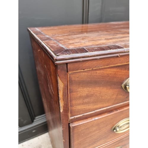 1054 - A George III mahogany and crossbanded bowfront four drawer chest, 78cm wide.