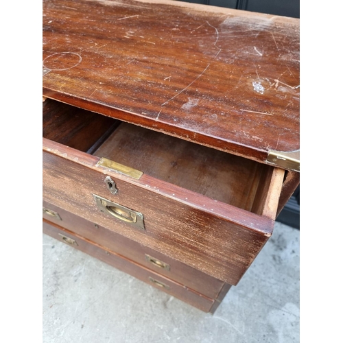 1055 - An old teak and brass bound campaign chest, in two parts, 91.5cm wide. 