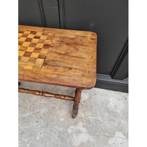1057 - A Victorian walnut and chequerboard inlaid rectangular table, 80cm wide. 