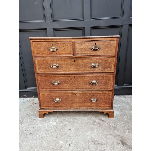 1059 - A George III oak and walnut banded chest of drawers, 96.5cm wide. 