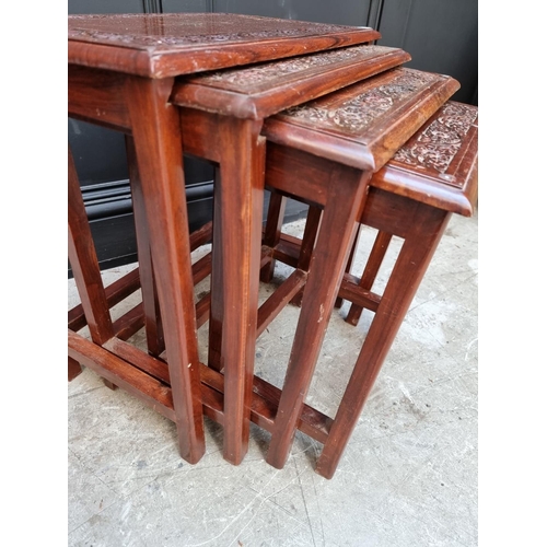 1063 - A nest of four Eastern carved hardwood and brass inlaid quartetto tables, largest 53cm wide. &n... 