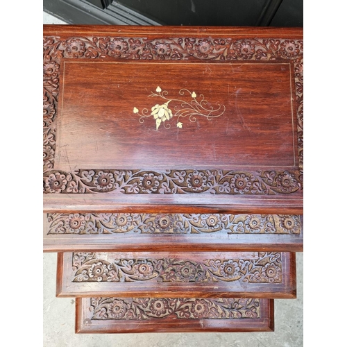 1063 - A nest of four Eastern carved hardwood and brass inlaid quartetto tables, largest 53cm wide. &n... 