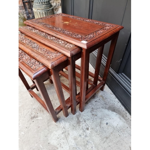 1063 - A nest of four Eastern carved hardwood and brass inlaid quartetto tables, largest 53cm wide. &n... 