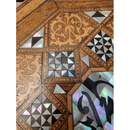 1064 - A Damascus marquetry and mother-of-pearl octagonal occasional table, with Islamic inscription, 46cm ... 