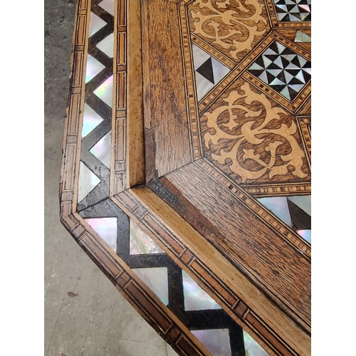 1064 - A Damascus marquetry and mother-of-pearl octagonal occasional table, with Islamic inscription, 46cm ... 