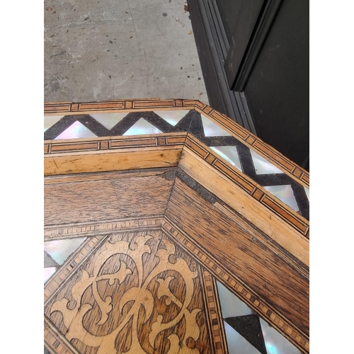 1064 - A Damascus marquetry and mother-of-pearl octagonal occasional table, with Islamic inscription, 46cm ... 