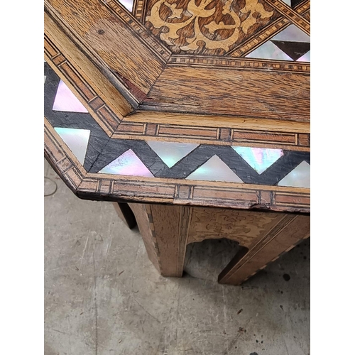 1064 - A Damascus marquetry and mother-of-pearl octagonal occasional table, with Islamic inscription, 46cm ... 