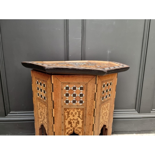 1064 - A Damascus marquetry and mother-of-pearl octagonal occasional table, with Islamic inscription, 46cm ... 