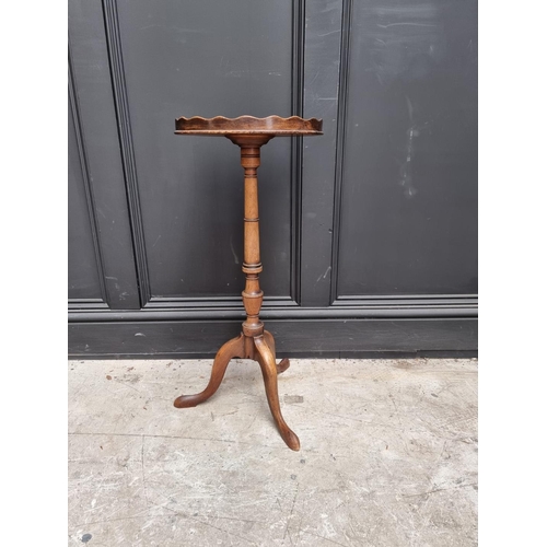 1068 - An 18th century style mahogany tripod wine table, with galleried oval top, 32cm wide. ... 