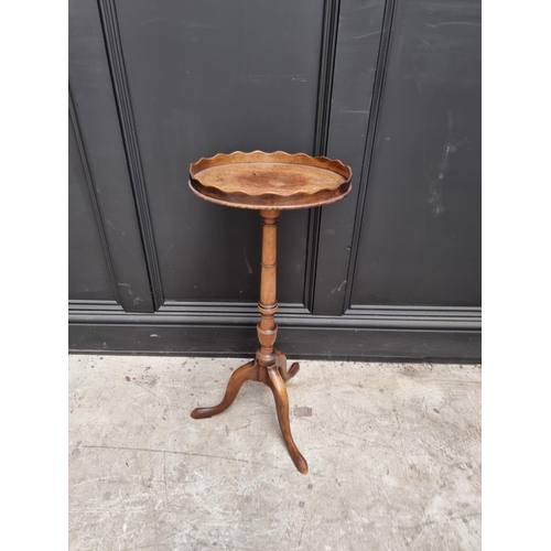 1068 - An 18th century style mahogany tripod wine table, with galleried oval top, 32cm wide. ... 