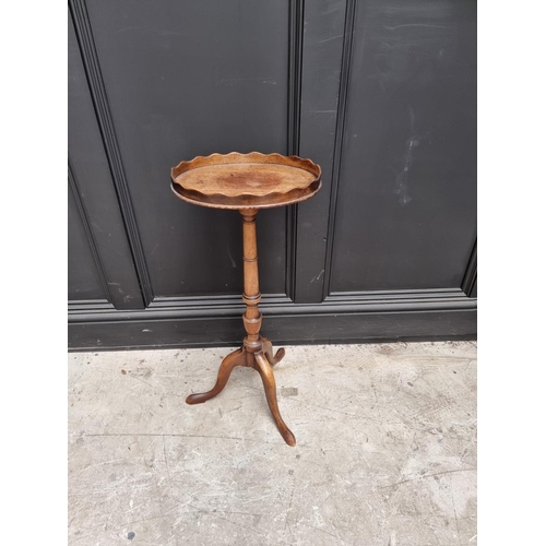 1068 - An 18th century style mahogany tripod wine table, with galleried oval top, 32cm wide. ... 