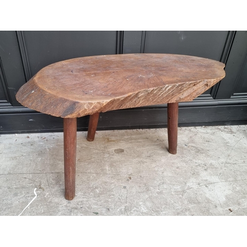 1069 - An oak tree truck low occasional table, 86cm wide.