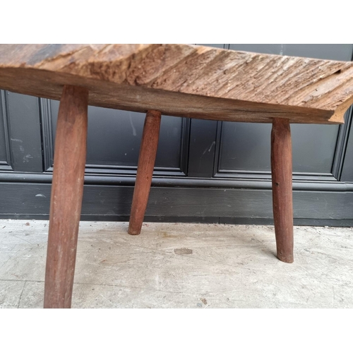 1069 - An oak tree truck low occasional table, 86cm wide.