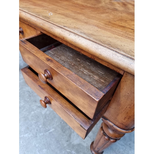 1071 - A Victorian mahogany desk, on reeded legs, 121cm wide.