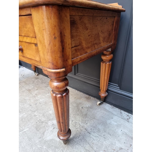 1071 - A Victorian mahogany desk, on reeded legs, 121cm wide.