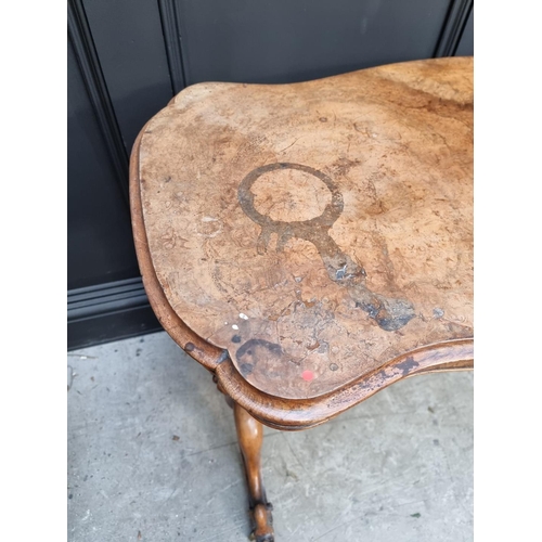 1072 - A Victorian figured walnut occasional table, of shaped outline, 108.5cm wide. 