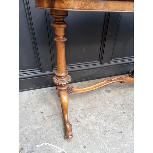 1072 - A Victorian figured walnut occasional table, of shaped outline, 108.5cm wide. 