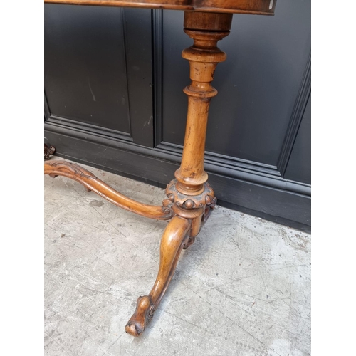 1072 - A Victorian figured walnut occasional table, of shaped outline, 108.5cm wide. 