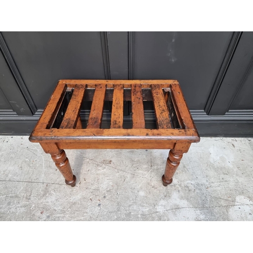 1073 - A Victorian oak luggage stand, stamped 'Gillows 2910', 60.5cm wide. 