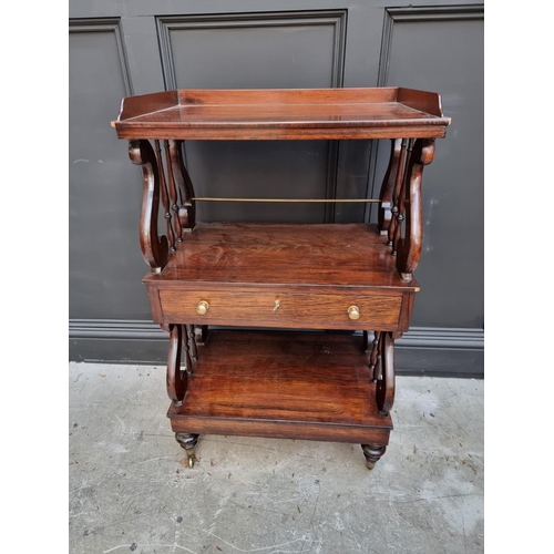 1074 - A Victorian rosewood three tier whatnot, of free standing form, 62cm wide.