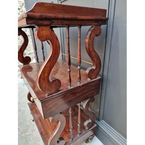 1074 - A Victorian rosewood three tier whatnot, of free standing form, 62cm wide.