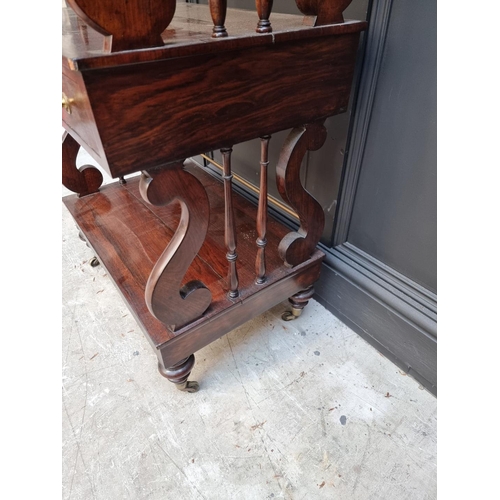 1074 - A Victorian rosewood three tier whatnot, of free standing form, 62cm wide.