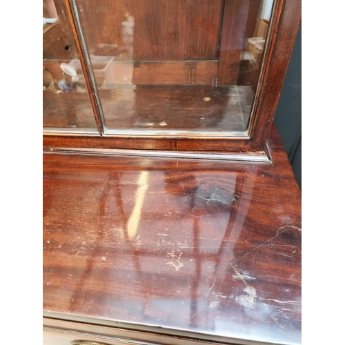 1076 - An early 19th century mahogany secretaire bookcase, 123cm wide.