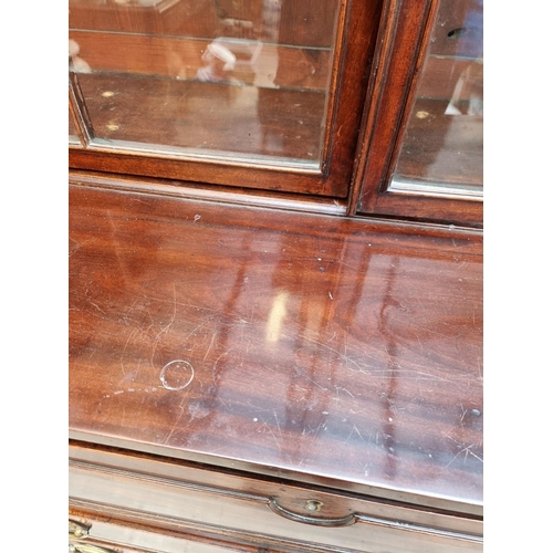 1076 - An early 19th century mahogany secretaire bookcase, 123cm wide.