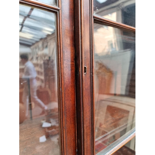 1076 - An early 19th century mahogany secretaire bookcase, 123cm wide.