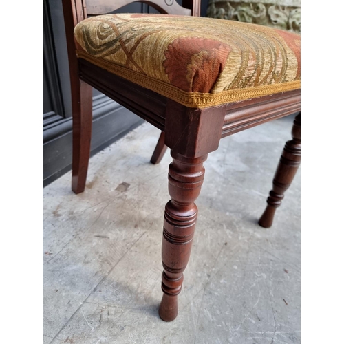 1082 - An unusual Victorian carved mahogany metamorphic chair, the folding back incorporating an oval mirro... 